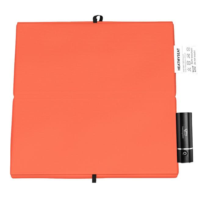 L'elegante tappetino riscaldante per esterni nel colore arancione - senza fili, con batteria e mobile